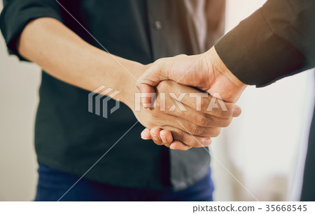 Joint Hands of Two Businessmen. 35668545