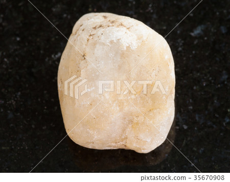 yellow marble stone on dark background yellow marble stone on dark background 35670908