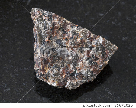 rough spreusteined urtite stone on dark rough spreusteined urtite stone on dark 35671020