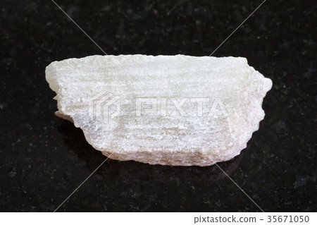 raw Talc stone on dark background 35671050