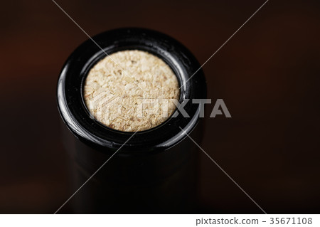 a bottle of wine closed with a cork 35671108