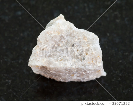 raw Conglomerate stone on dark background 35671232