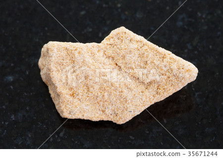 rough sandstone stone on dark background 35671244