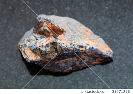 raw Wolframite stone (tungsten ore) on dark 35671258