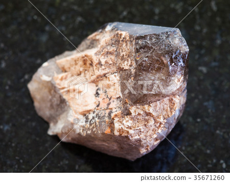 raw crystal of smoky quartz gemstone on dark raw crystal of smoky quartz gemstone on dark 35671260