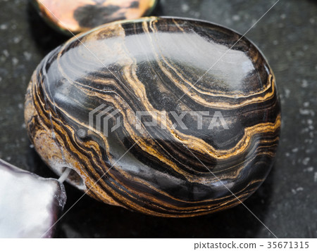 pendant from Stromatolite gemstone on dark 35671315