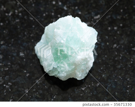 raw Fluorite stone on dark background 35671330