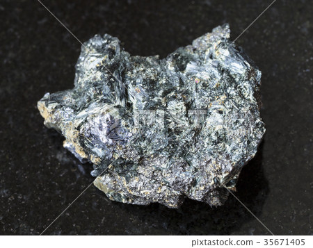 Molybdenite in Glaucophane stone on dark 35671405