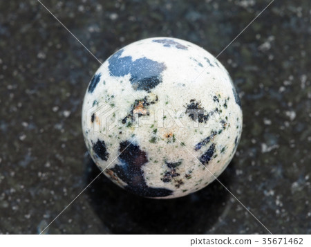 bead from Dalmatian Jasper gemstone on dark 35671462