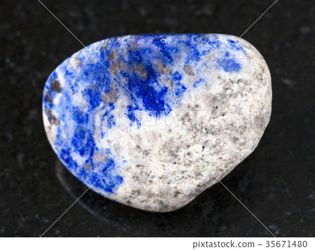 polished lazurite stone on dark background 35671480