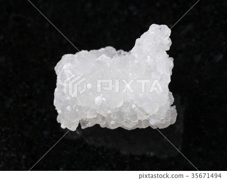 raw crystal of Prehnite stone with Okenite on dark 35671494