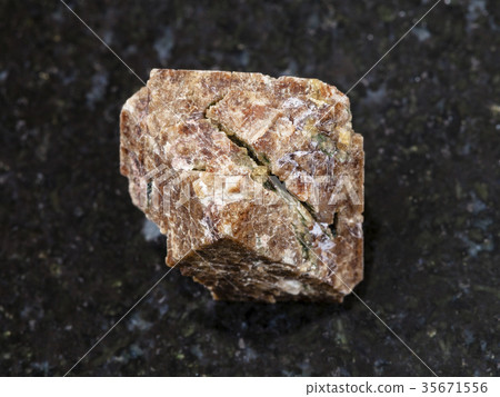 crystal of Zircon gemstone on dark background crystal of Zircon gemstone on dark background 35671556