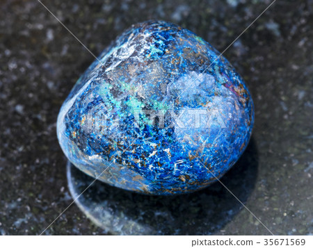polished Azurite gemstone on dark background 35671569