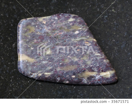 polished Alunite stone on dark background 35671571