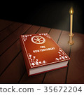 New Testament book on wood table with candle 35672204