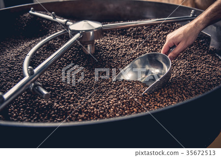 Male arm taking grains with special equipment 35672513
