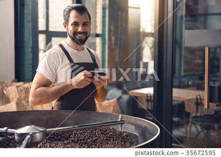 Outgoing worker drinking cup of beverage 35672595