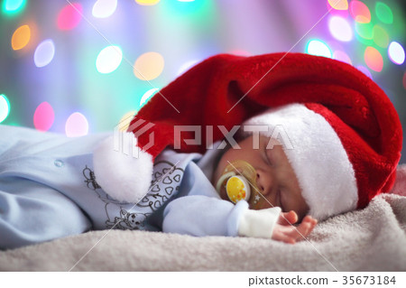 Newborn baby in santa hat 35673184