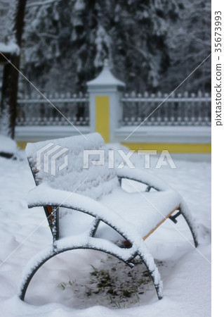 winter bench covered snow 35673993