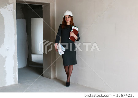 female architect at the construction site with 35674233
