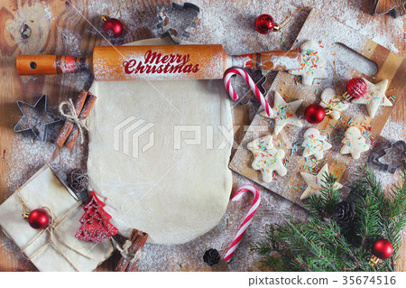 Flour cooking ginger cookies on Christmas Eve Flour cooking ginger cookies on Christmas Eve 35674516