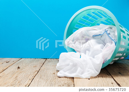 laundry basket of clothes on wooden laundry basket of clothes on wooden 35675720