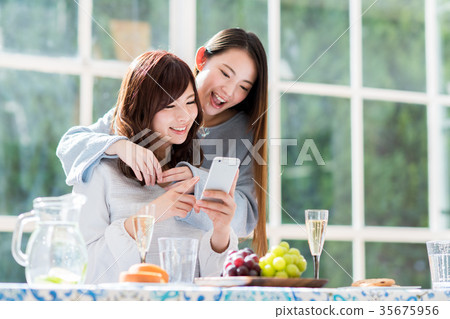 A young lady (a smartphone) A young lady (a smartphone) 35675956
