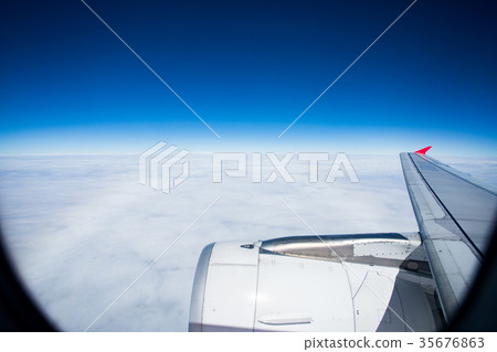 plane flying over white cloud and clear blue sky plane flying over white cloud and clear blue sky 35676863
