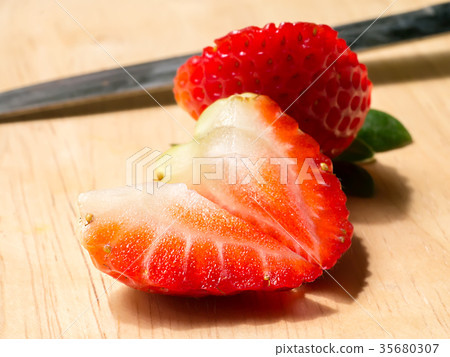 Close up of strawberry on wood. Close up of strawberry on wood. 35680307