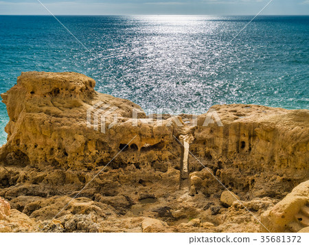 Sandcastle formation on the coast of Carvoeiro 35681372