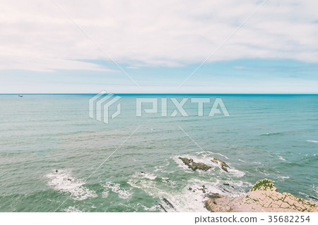 Blue sky over calm ocean 35682254