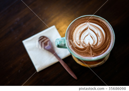 Cup of hot cocoa (coffee) with hearted milk. 35686098