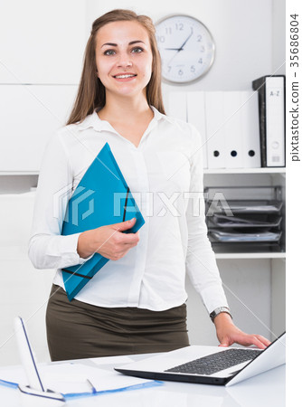 Young woman is going to sign profitable financial agreement 35686804