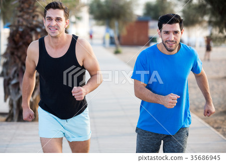 Two friends are jogging in time training 35686945