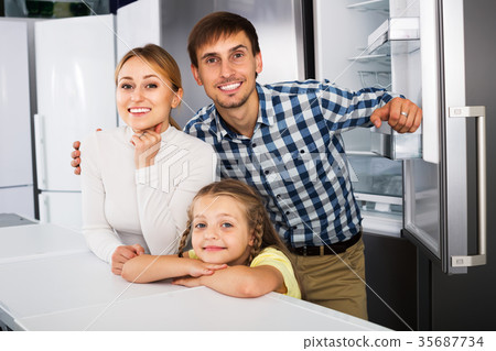 Family choosing refrigerator in store Family choosing refrigerator in store 35687734
