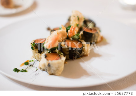 Salmon and shrimps dish 35687778
