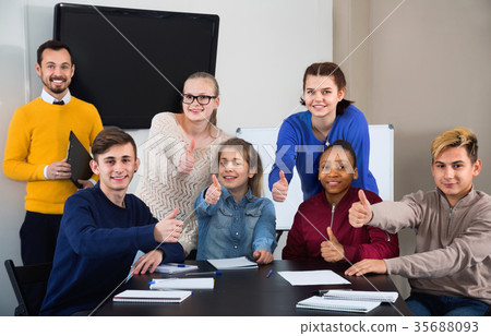 Classmates displaying their enjoyment of school studies animatedly Classmates displaying their enjoyment of school studies animatedly 35688093