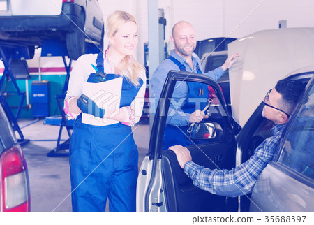 People at a car repair shop People at a car repair shop 35688397
