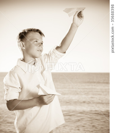 boy playing paper plane boy playing paper plane 35688398