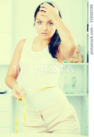 woman is upset with measurement woman is upset with measurement 35688399