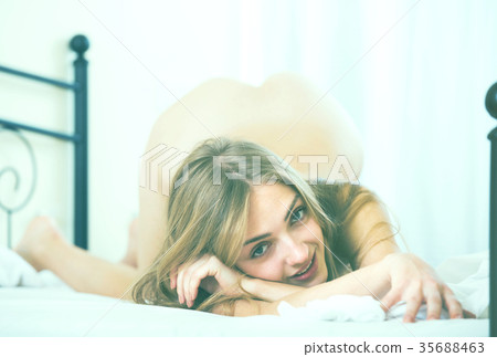 Portrait of slim brunette in bedroom. 35688463