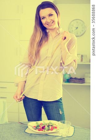 Woman eating healthy to lose weight 35688868