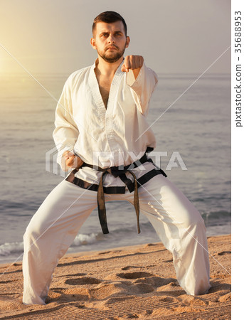 guy demonstrates karate poses 35688953