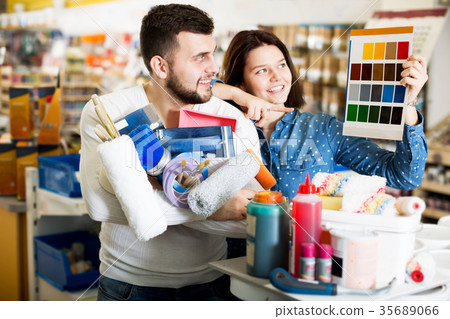 Couple examining color scheme variants Couple examining color scheme variants 35689066