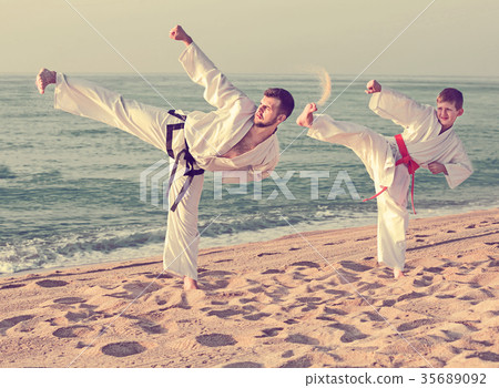 boy and a teacher are practicing karate 35689092