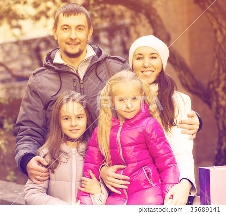 Portrait of happy adults with daughters 35689141