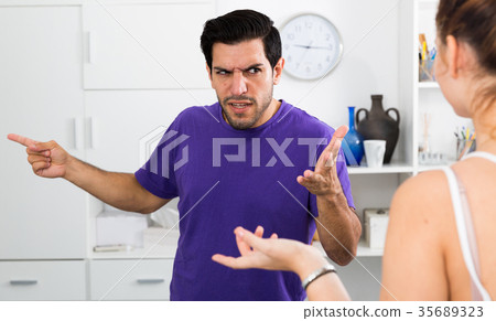 Angry man in quarrel with girl 35689323