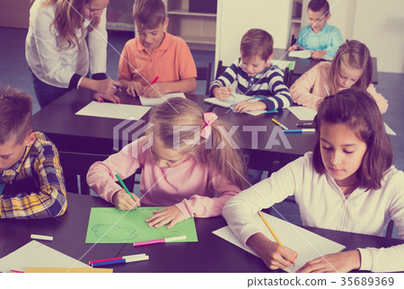 Portrait of smiling children in elementary age drawing 35689369