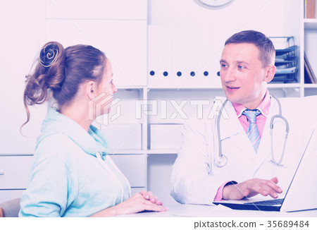 Doctor and female visitor Doctor and female visitor 35689484