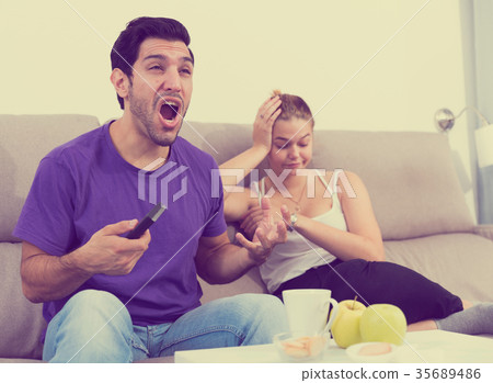 Woman offended on husband, keen on watching TV Woman offended on husband, keen on watching TV 35689486